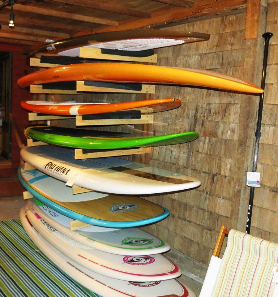 WALL OF SUP BOARDS - Cape Cod Beach Chair Company and Adventure Chatham - Cape Cod